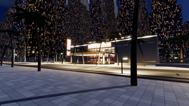 The city at night: lit towers, street palms and a brightly lit casino-style building