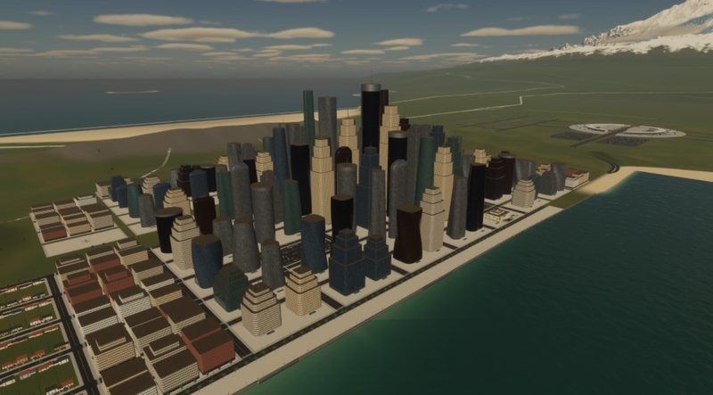 Downtown from the air: clustered skyscrapers, low-rise suburbs, the beach and two stadiums